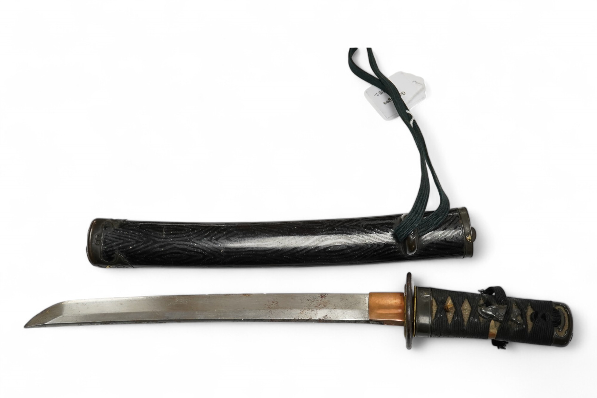 A Japanese tanto dagger, blade 26.8cm, unsigned, suriage, copper tsuba, tape bound tsuka, shakudo fuchi kashira with gilt insects, in its black lacquered saya with matching mounts and iron kodzuka. Condition - fair, some